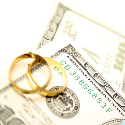 wedding rings on top of money