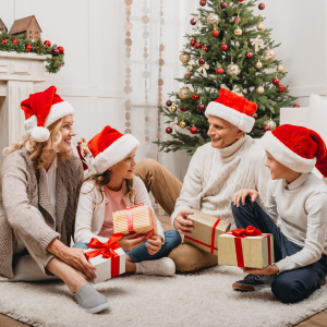 happy blended family at Christmas next to tree